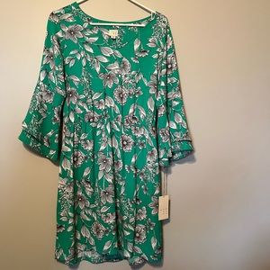 Green dress with black and white flowers. Never worn.